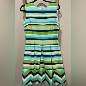 Bright blue and green midi dress with full pleated skirt.